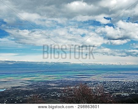 Top View Of Alazani Valley In Georgia In Springtime, In The Distance Through The Haze Visible To The