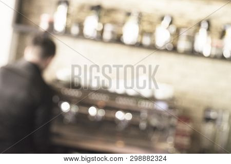 Professional Expert Barista Makes Coffee With A Coffe Machine. Man Making Fresh Espresso In Coffee M