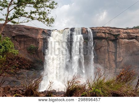 This Is The Athirapally Waterfall Kerala India From Down Angle View. It Is Falling From 80 Mtrs High