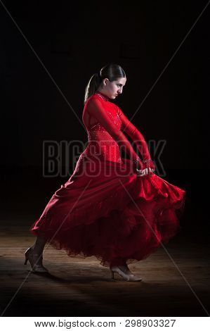 Young Hispanic Flamenco Dancer In Red Dress Isolated On Black Background