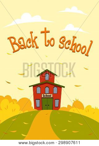 School On A Hill Among Autumn Trees Against A Beige Sky And White Clouds