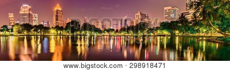Panoramic view of Bangkok skyline. Night cityscape of Bangkok, Thailand. View from Lumphini park