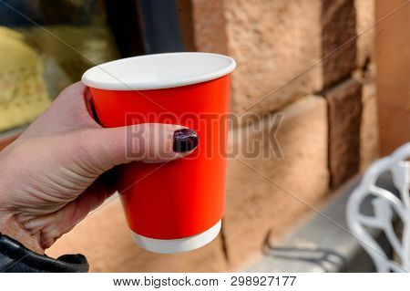 beautiful red paper cup with latte in spring
