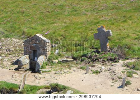 Fountain And Cross Of Saint Samson Chapel Near The Coast In Landunvez