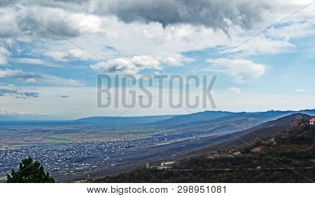 Top View Of Alazani Valley In Georgia In Springtime, In The Distance Through The Haze Visible To The