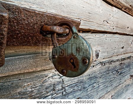 An Old Lock Hangs On A Wooden Door At The Old Town Of Kalajoki, Finland. The Old Fishing Village Has
