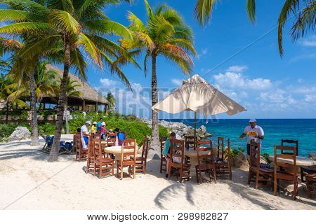 XCARET,MEXICO - APRIL 16,2019 : Restaurant at the beach on the XCaret park on a beautiful sunny day