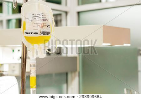 Closeup Blood Platelet In A Medical Bag Hanging On A Pole And Transferring To A Sick Newborn Baby At