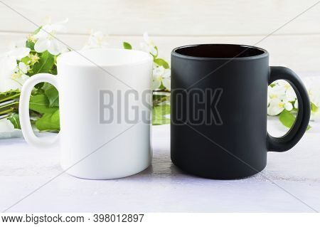 White And Black Mug Mockup With Spring Apple Blossom. Coffee Cup Mockup. Empty Mug Mockup For Produc