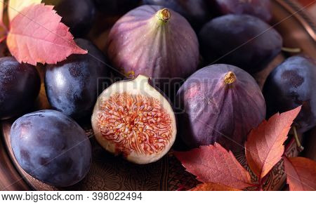 Ripe Plums And Figs On A Platter. Nice Photo Of Food. Banner.