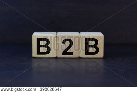 B2b Symbol. Concept Word 'b2b - Business To Business' On Cubes On A Beautiful Dark Wooden Background