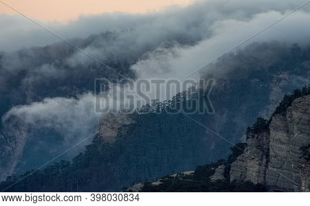 Mountains And Forests Of Crimea. Coniferous And Deciduous Trees On The Hills Of The Mountains And Ro