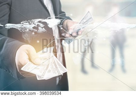 Money In Businessman Hand And Worldmap Connection Background, Us Dollar,investment, Success And Prof