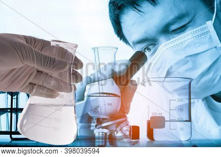 Double Exposure Of Scientist Using Microscope With Lab Glassware Background, Laboratory Research Con