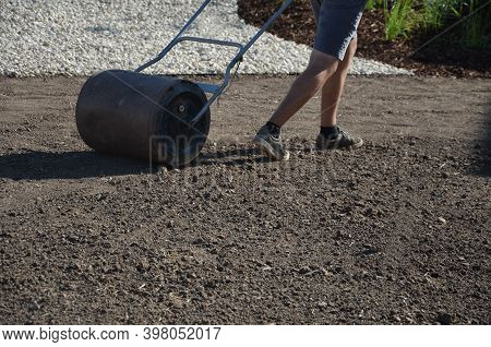 Soil Preparation Before Sowing The Lawn With A Soil Cultivator. Soil Loosening, Raking, Sowing. The 
