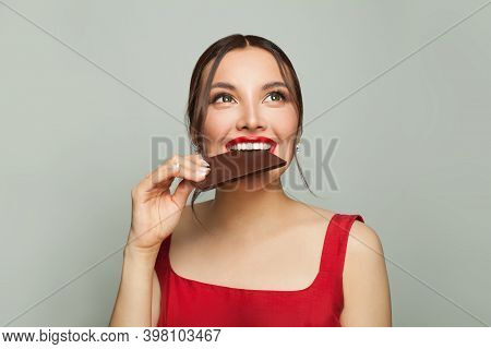 Pretty Woman Biting Chocolate, Cheat Meal And Diet Concept