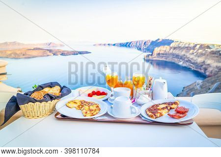 Breakfast For Two With Coffee, Fresh Orabge Juice And Yogurt At Morning By Seaside, Greece, Toned