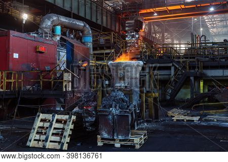 Iron Casting And The Foundry. Overhead Crane With Ladle With Molten Metal At Metallurgical Factory