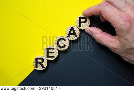 Recap Symbol. Wooden Circles With Word 'recap' Stacking As Step Stair On Paper Yellow And Black Back