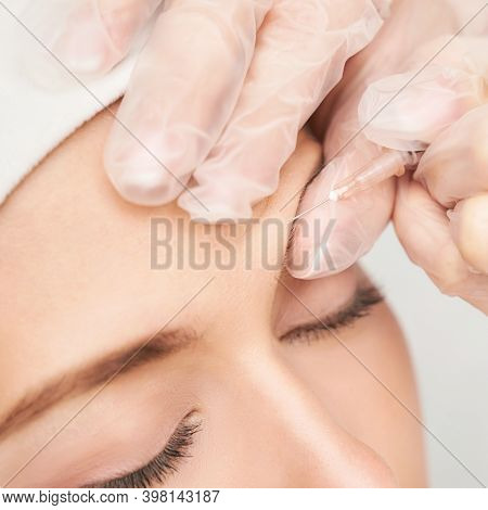 Forehead Injection At Spa Salon. Doctor Hands. Closeup. High Quality. Pretty Female Patient. Beauty 