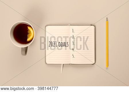 2021 Goals Banner. Notebook, Pencil And Cup Of Tea On Toned In Champagne Color. Banner With Copy Spa
