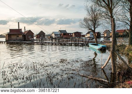 A Picture From Hungary, From A Place Called Bokod. The Local People Have The Wooden Cottages On Pylo