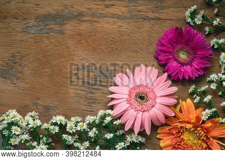 Pink Gerbera Flower Decoration On Rustic Wooden Table, Copy Space