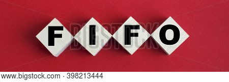 The Business Abbreviation Fifo Written On Wooden Blocks On Red Background