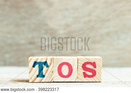 Alphabet Letter Block In Word Tos (abbreviation Of Terms Of Service) On Wood Background