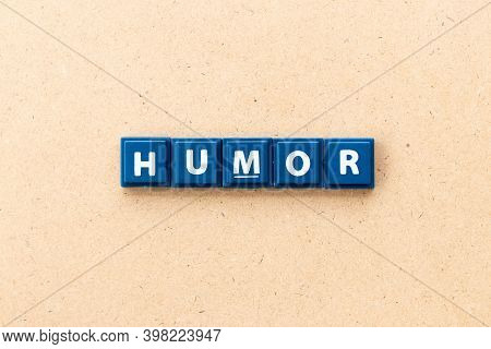 Tile Letter In Word Humor On Wood Background