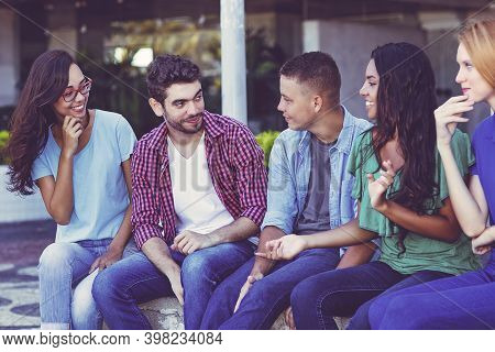 Multi Ethnic Young Adults Talking About In Poltics And Lifestyle In Vintage Retro Look