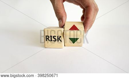 Risk Symbol. Wooden Cube With Word 'risk'. Male Hand Turns The Wooden Cube Changes The Direction Of 