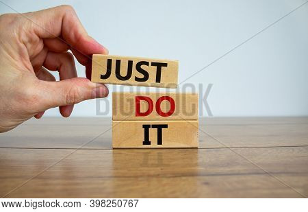 Just Do It Symbol. Male Hand Placing A Block On Top Of A Blocks Tower With Words 'just Do It'. Beaut