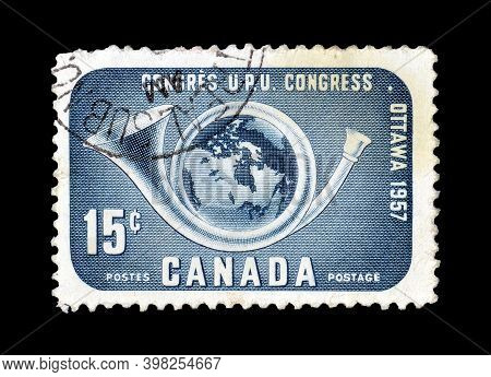 Canada - Circa 1957 : Cancelled Postage Stamp Printed By Canada, That Shows Postal Trumpet An Earth,