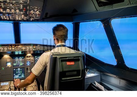 Gdansk, Poland - December 06, 2020: Instructor In The Flight Simulator Cabin During Training