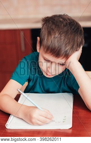 Close Up Of Child Writing Letters A B C In Notebook