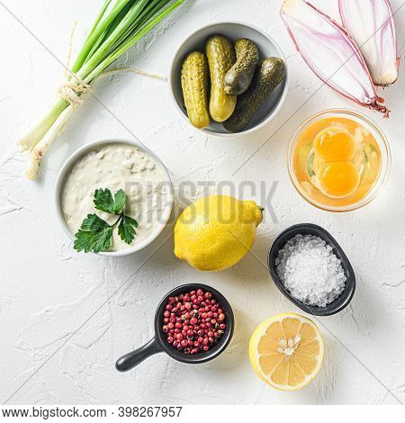 Organic Tartare In A White Porcelain Bowl With Vegetables Ngredients Capers, Cucumbers, Parsley, Lem