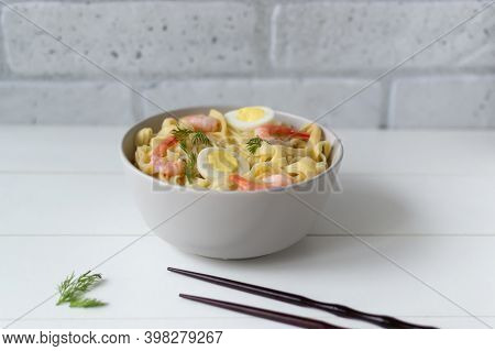 Natural Homemade Noodles With Shrimps And Quail Eggs On A Light Background. Horizontal Orientation. 