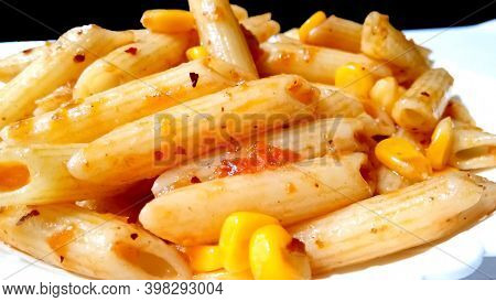 Closup Of Penne Pasta With Tomato Sauce