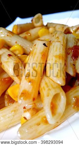 Closup Of Penne Pasta With Tomato Sauce