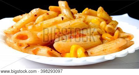 Closup Of Penne Pasta With Tomato Sauce