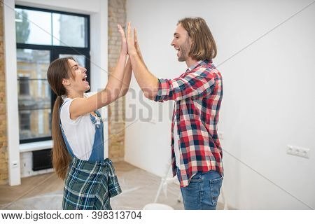 Happy Couple Claping Hands And Feeling Happy