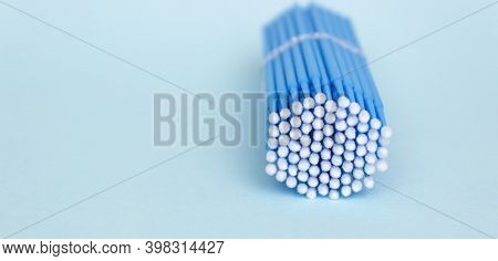 Blue Microbrushes, Small Brushes For Cleaning Eyelashes And Teeth. Blue Background. Dentistry, Eyela