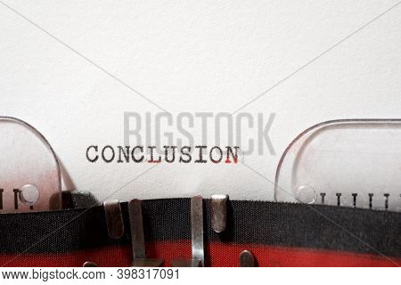Conclusion word written with a typewriter.