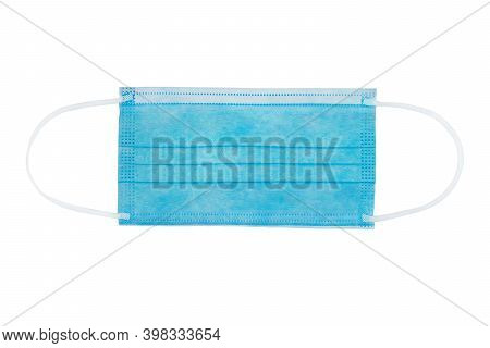 Blue Flat Medical Nonwoven Fabric Face Mask With Elastic Ear Loops Isolated On White. Surgical Perso