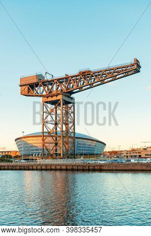 GLASGOW, UK - FEB 26, 2020: The Finnieston Crane or Stobcross Crane stand at waterfront of city center in Scotland, United Kingdom as the symbol of engineering heritage