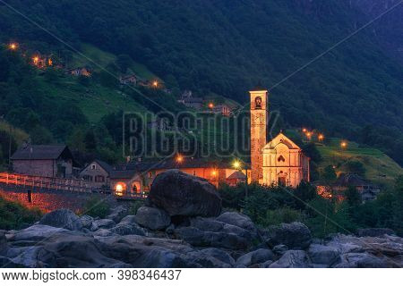 Papal Minor Basilica In Lavertezzo Village At The Verzasca River At Night. This Village Is Located I