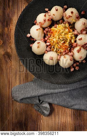 Meat Stuffed Potato Dumplings With Fried Onion And Greaves.