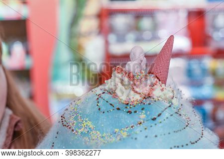 Sweets And Candy On A Huge Cotton Candy Floss With Ice Cream And Dessert Sauce