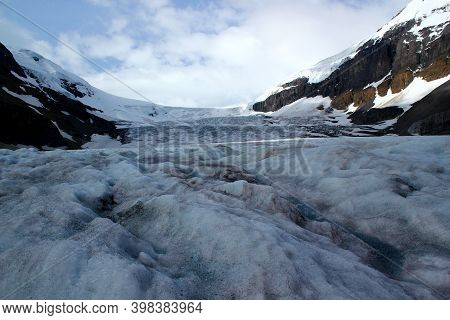 Directly At The Glacier: Columbia Icefield / Athabsca Glacier In The Canadian Rocky Mountains In Ban